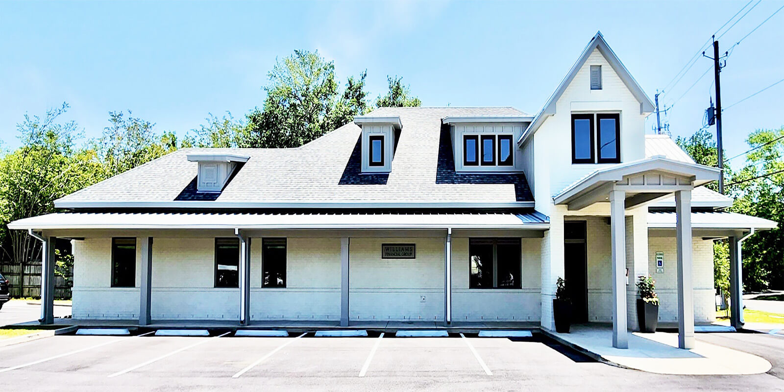 Williams Financial Group mobile office building with their sign visible.